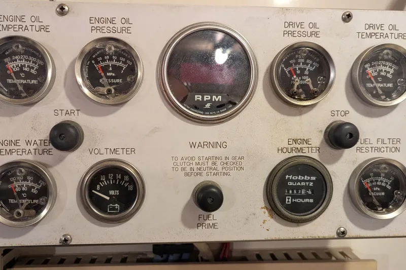  Yacht Photos Pics Control panel of a 1992 Viking 65 Motor Yacht with gauges and switches.