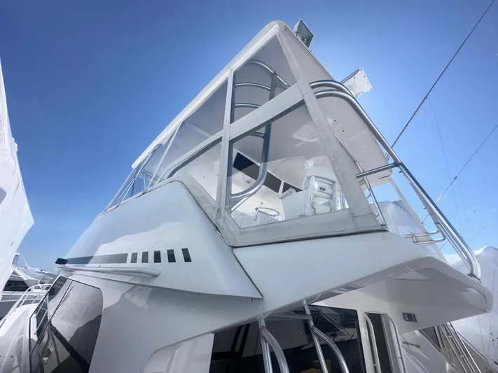  Yacht Photos Pics 1998 Viking 53 Convertible yacht, sleek design, upper deck view, clear blue sky background.