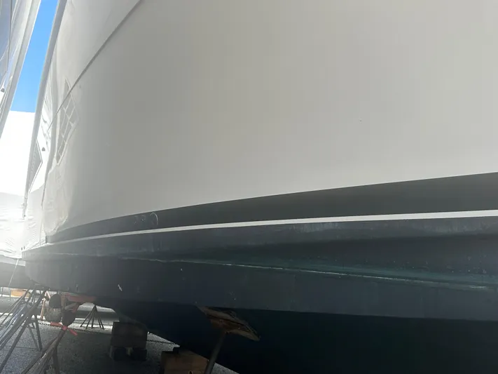  Yacht Photos Pics 1998 Viking 53 Convertible yacht hull in dry dock, side view.