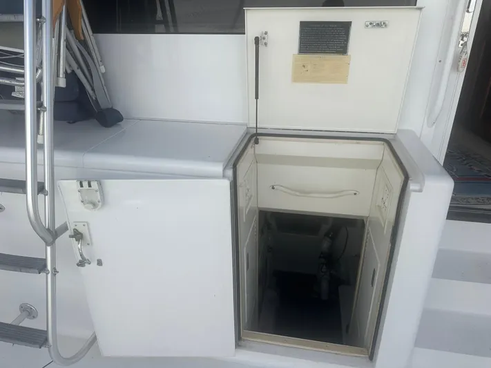  Yacht Photos Pics 1998 Viking 53 Convertible yacht interior access hatch with storage compartments.