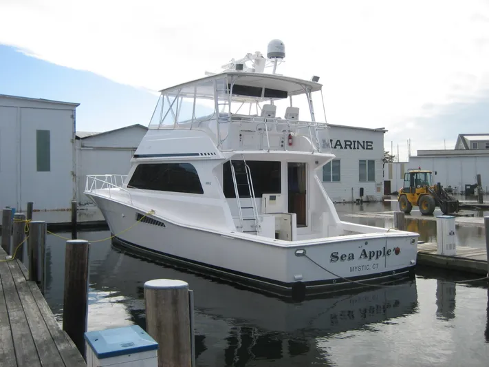  Yacht Photos Pics 1998 Viking 53 Convertible yacht docked at a marina, named "Sea Apple."