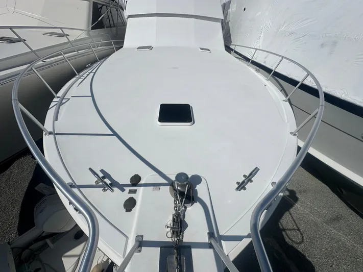  Yacht Photos Pics 1998 Viking 53 Convertible yacht deck with railing and hatch.