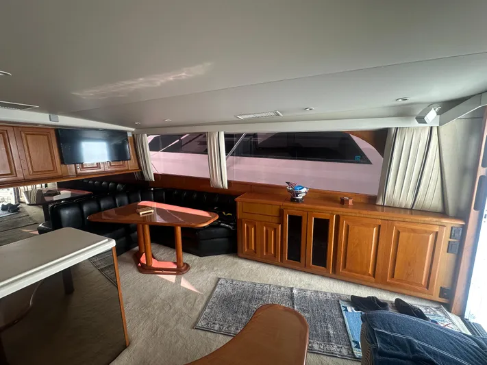  Yacht Photos Pics Interior of 1998 Viking 53 Convertible yacht with wood cabinetry and seating area.