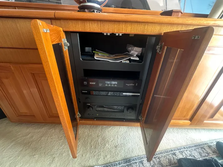  Yacht Photos Pics Open cabinet on 1998 Viking 53 Convertible yacht showing electronic equipment and storage.