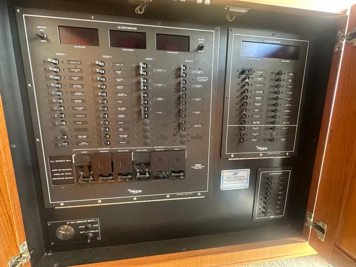  Yacht Photos Pics Electrical panel of a 1998 Viking 53 Convertible boat, featuring switches and meters.