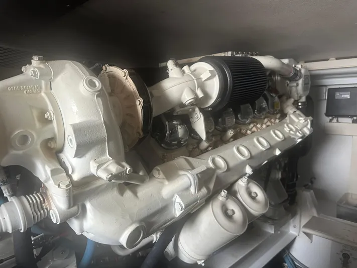  Yacht Photos Pics Engine of a 1998 Viking 53 Convertible boat, showcasing intricate mechanical components.