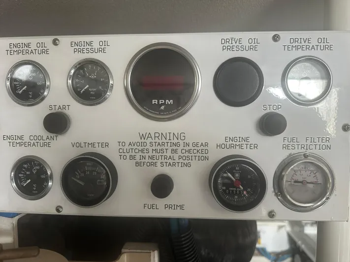 Yacht Photos Pics Control panel of a 1998 Viking 53 Convertible boat with various gauges and warning labels.