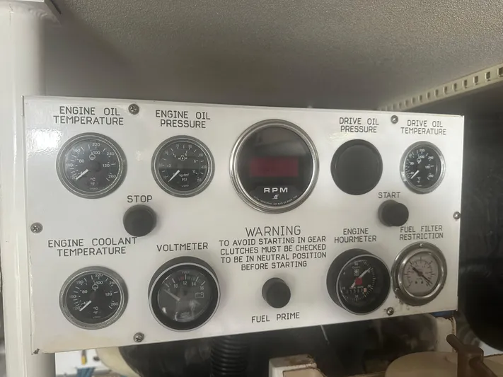  Yacht Photos Pics Control panel of a 1998 Viking 53 Convertible boat with various gauges and warning labels.