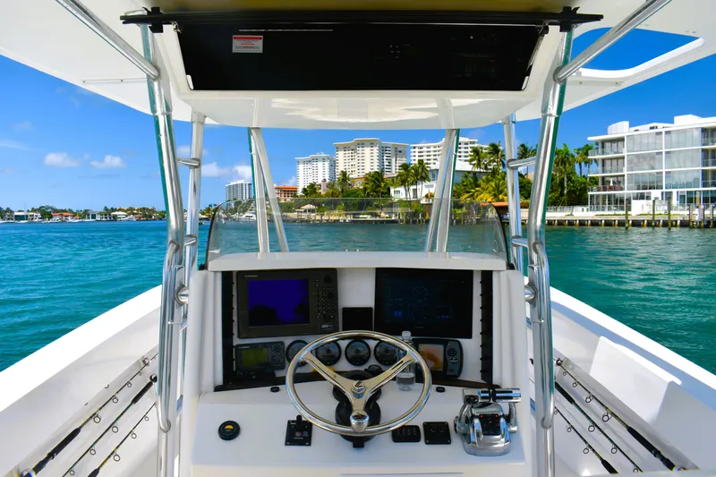  Yacht Photos Pics 2005 Venture 39 Open boat helm with ocean view and city skyline.