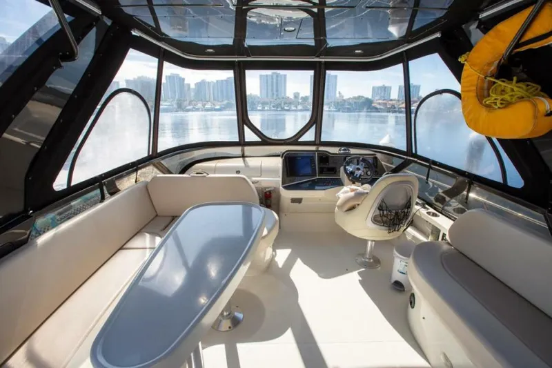 Tropical Life Yacht Photos Pics Luxurious 2012 Carver Sojourn yacht interior with panoramic windows and modern seating.