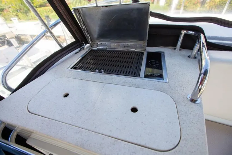 Tropical Life Yacht Photos Pics Outdoor grill on a 2012 Carver Sojourn yacht, featuring a sleek countertop design.