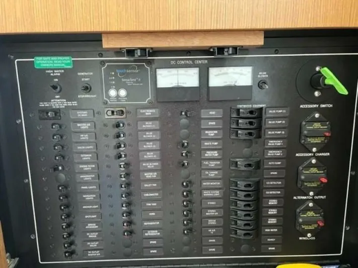 Tropical Life Yacht Photos Pics Electrical control panel on a 2012 Carver Sojourn boat, featuring switches and meters.