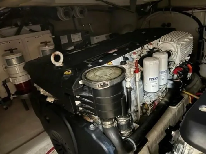 Tropical Life Yacht Photos Pics Engine room of a 2012 Carver Sojourn boat, showcasing detailed mechanical components.