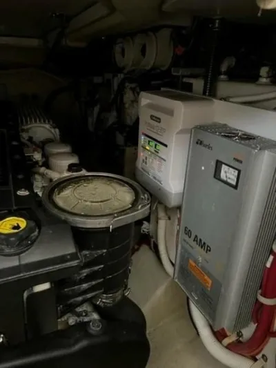 Tropical Life Yacht Photos Pics Engine room of a 2012 Carver Sojourn with electrical components and machinery.