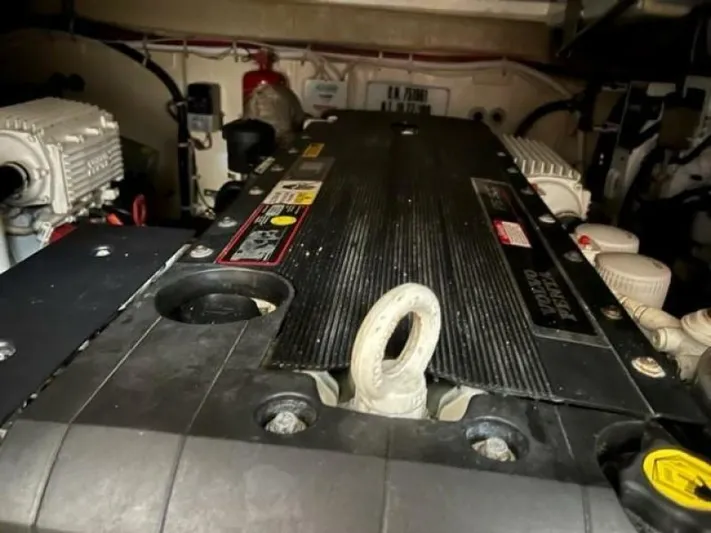 Tropical Life Yacht Photos Pics Engine compartment of a 2012 Carver Sojourn boat, showcasing mechanical components and wiring.