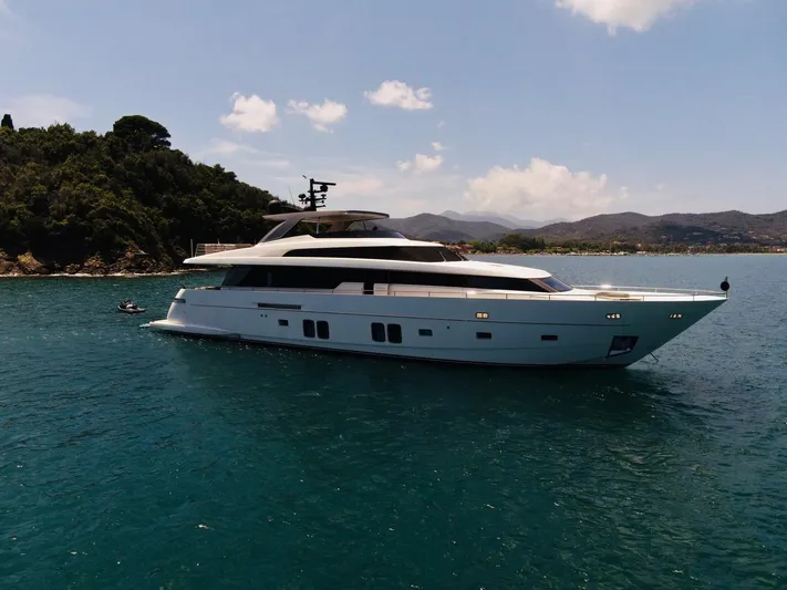 Sanlorenzo Sl96 Yacht Photos Pics Luxury 2016 Sanlorenzo SL96 yacht cruising on serene waters near a lush coastline.