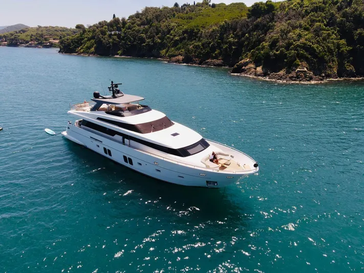 Sanlorenzo Sl96 Yacht Photos Pics Luxurious 2016 Sanlorenzo SL96 yacht cruising in clear blue waters near a lush coastline.