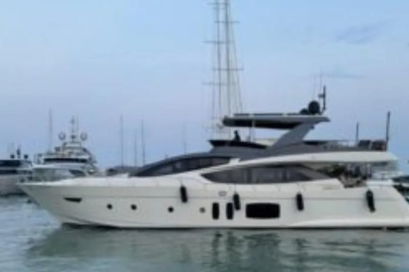  Yacht Photos Pics Luxury 2007 Astondoa A 76 GLX yacht docked in a serene marina setting.