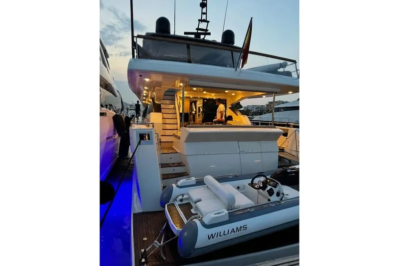  Yacht Photos Pics Luxurious 2007 Astondoa A 76 GLX yacht with illuminated deck and tender boat.