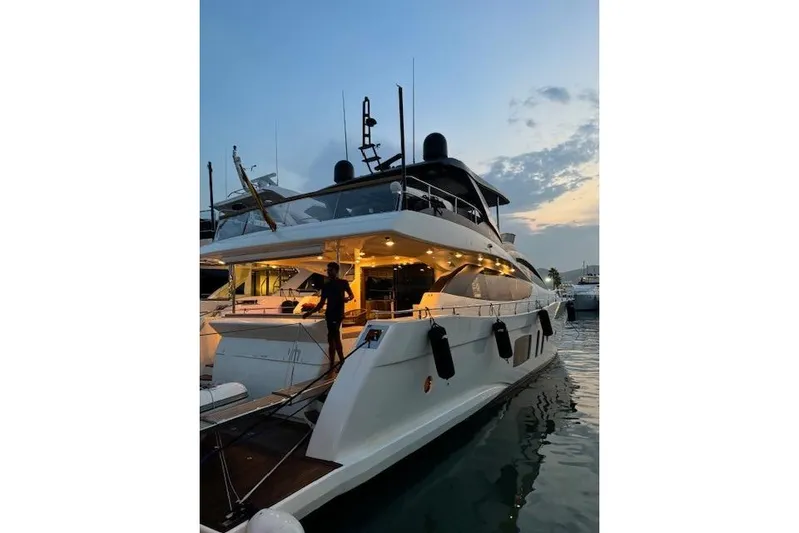  Yacht Photos Pics Luxurious 2007 Astondoa A 76 GLX yacht docked at sunset, illuminated deck.