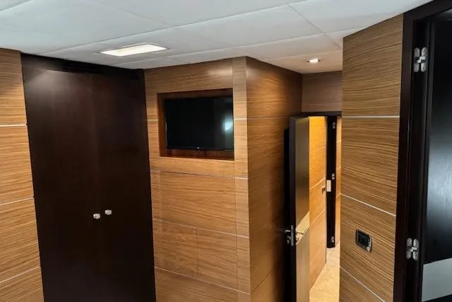  Yacht Photos Pics Interior of 2007 Astondoa A 76 GLX yacht with wood paneling and wall-mounted TV.