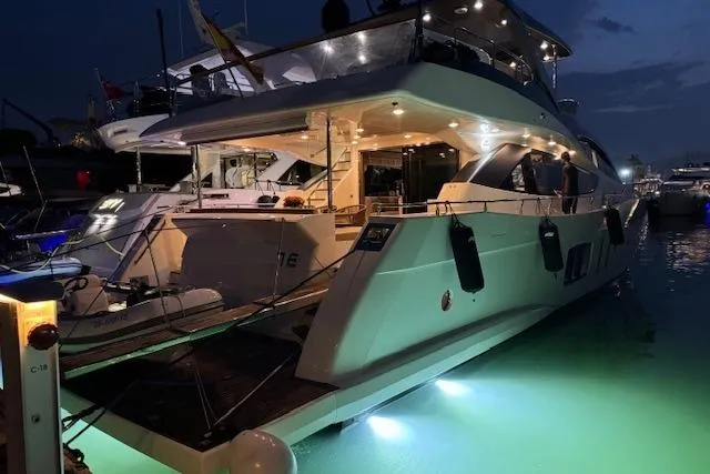  Yacht Photos Pics Luxurious 2007 Astondoa A 76 GLX yacht docked at night with glowing underwater lights.