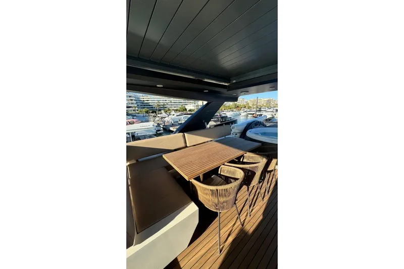  Yacht Photos Pics Luxurious 2007 Astondoa A 76 GLX yacht deck with seating and marina view.