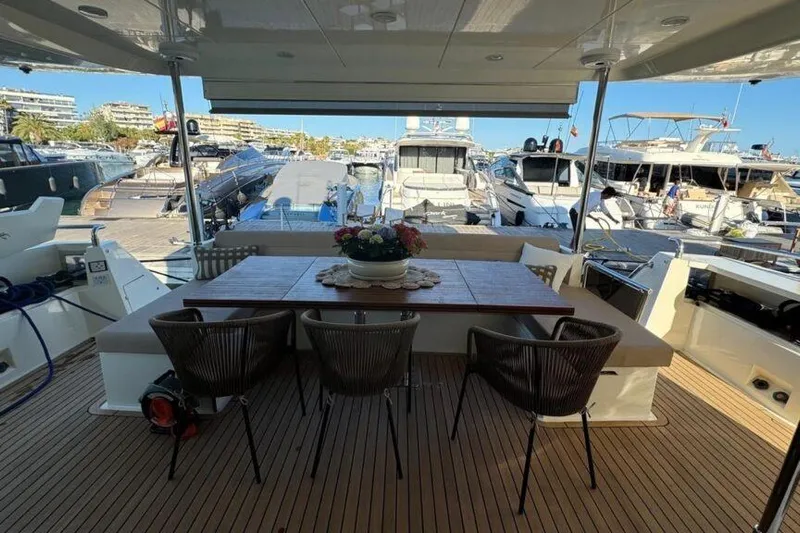  Yacht Photos Pics Luxury yacht Astondoa A 76 GLX 2007, elegant deck dining area with marina view.