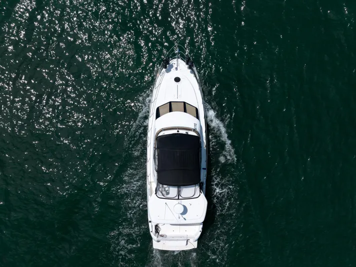 Summer Breeze Yacht Photos Pics Aerial view of 2008 Meridian 459 Motoryacht cruising on sparkling water.