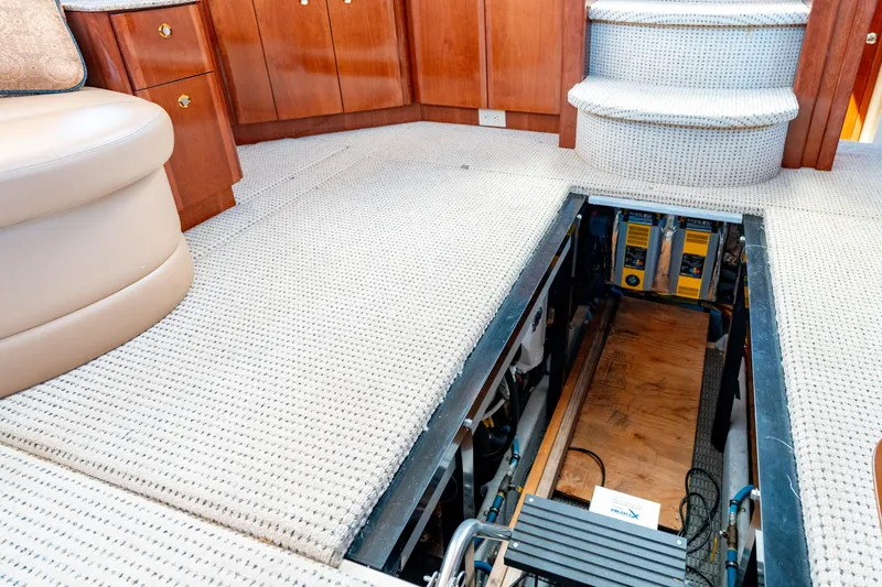 Summer Breeze Yacht Photos Pics 2008 Meridian 459 Motoryacht interior with open engine access panel.