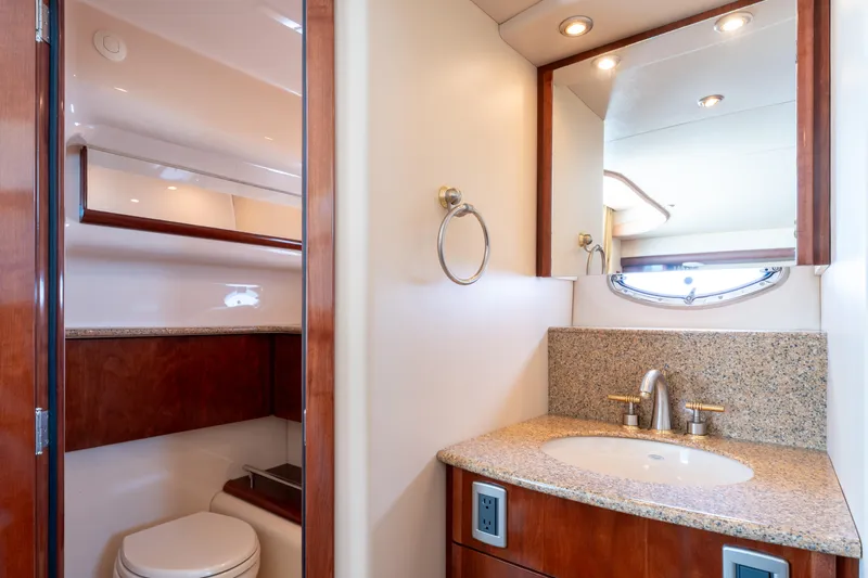 Summer Breeze Yacht Photos Pics Luxurious bathroom in 2008 Meridian 459 Motoryacht with granite countertop and modern fixtures.
