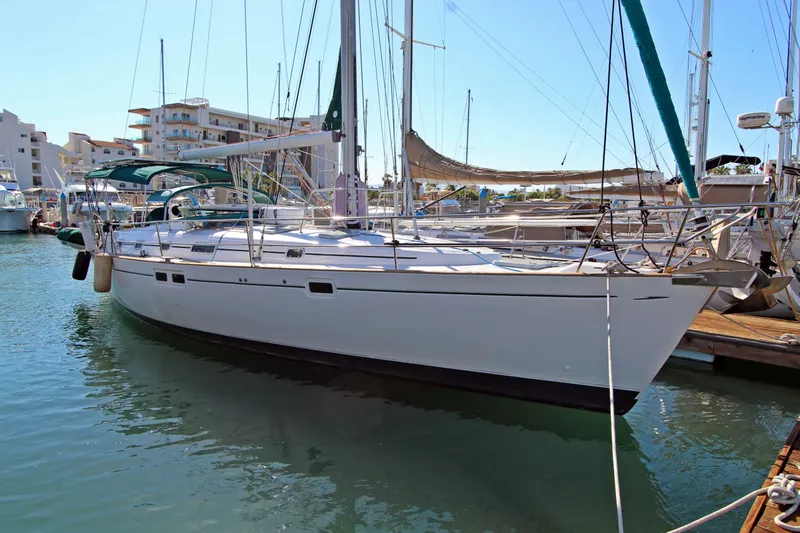 Oya Yacht Photos Pics 2001 Beneteau Oceanis 461 sailboat docked in a marina, sunny day.