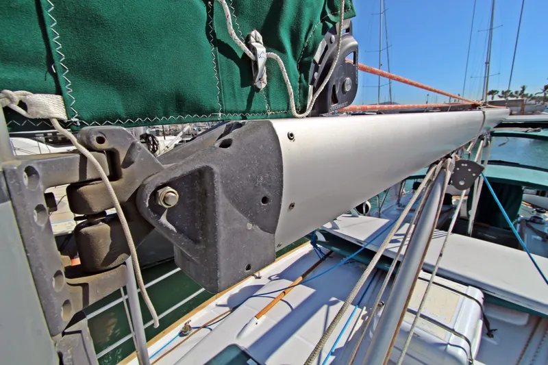 Oya Yacht Photos Pics Close-up of 2001 Beneteau Oceanis 461 sailboat rigging and boom in marina.