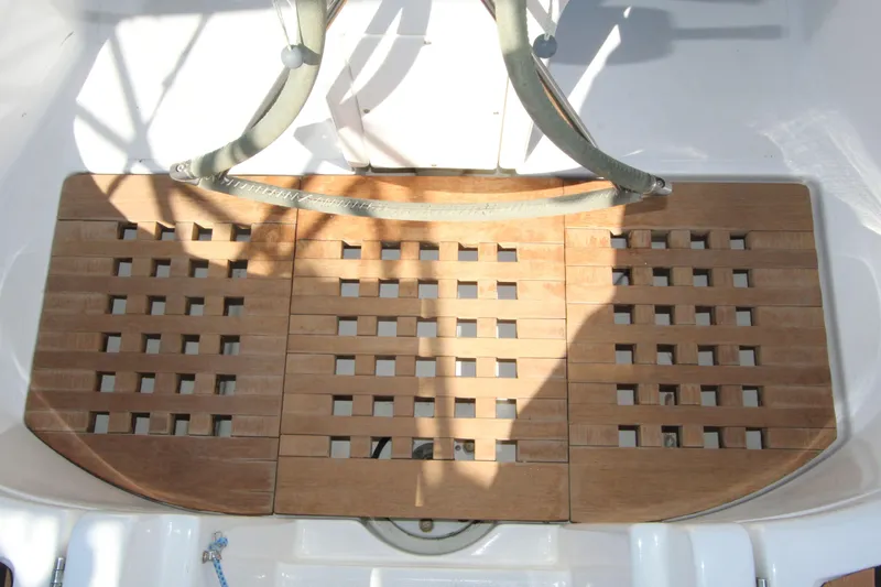 Oya Yacht Photos Pics Teak cockpit floor of 2001 Beneteau Oceanis 461 sailboat, featuring a grid pattern design.