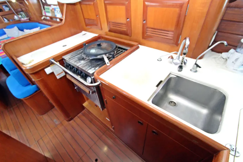 Oya Yacht Photos Pics Galley kitchen in 2001 Beneteau Oceanis 461 yacht with stove and sink.