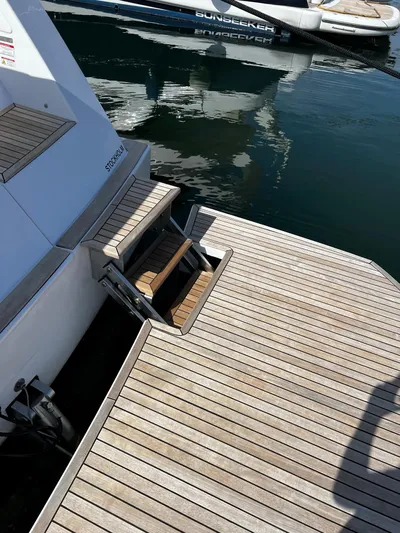  Yacht Photos Pics Pardo Yachts 50, 2023, featuring elegant wooden platform by the water.