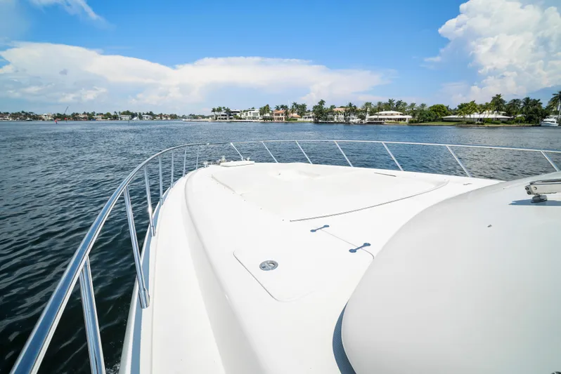 Gabriela G Yacht Photos Pics Bow view of 2001 Mangusta 72 yacht cruising on a sunny day.