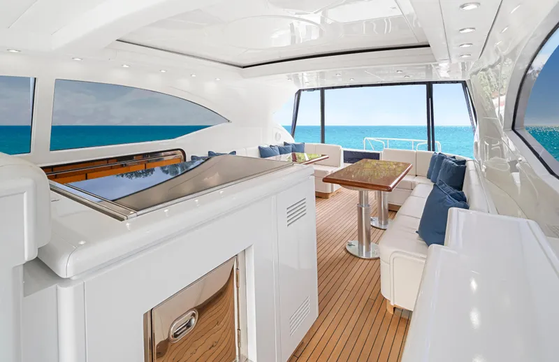 Gabriela G Yacht Photos Pics Luxurious interior of 2001 Mangusta 72 yacht with ocean view and elegant seating area.