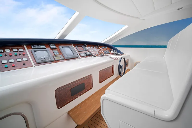 Gabriela G Yacht Photos Pics Cockpit of 2001 Mangusta 72 yacht with modern controls and panoramic view.