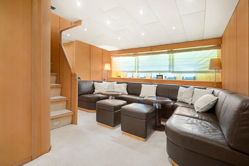 Gabriela G Yacht Photos Pics Luxurious interior of 2001 Mangusta 72 yacht with leather seating and elegant lighting.