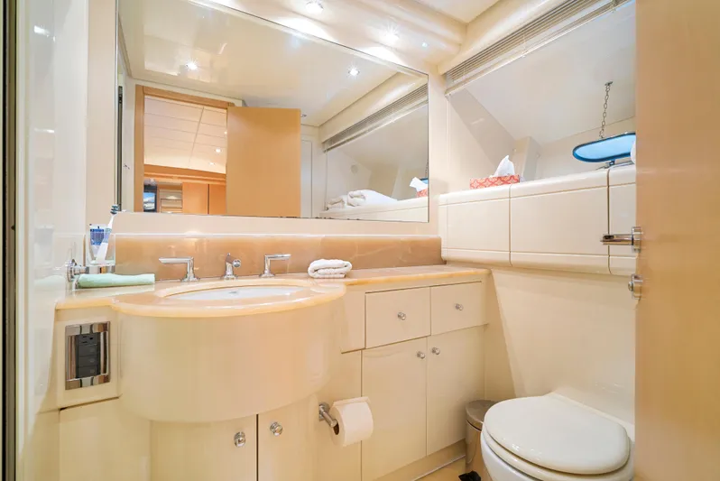 Gabriela G Yacht Photos Pics Luxurious bathroom interior of a 2001 Mangusta 72 yacht, featuring elegant fixtures and ample storage.