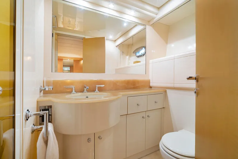 Gabriela G Yacht Photos Pics Luxurious bathroom in a 2001 Mangusta 72 yacht, featuring modern fixtures and elegant design.