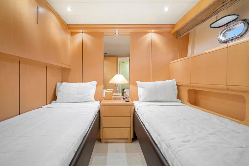 Gabriela G Yacht Photos Pics Luxurious twin cabin interior of 2001 Mangusta 72 yacht with modern furnishings.