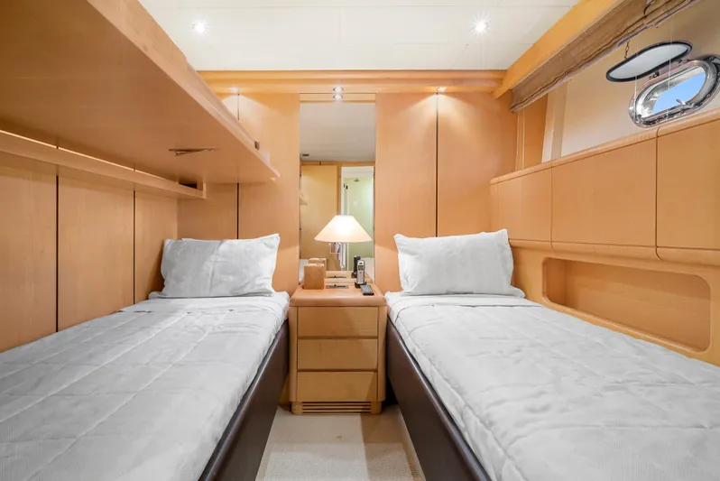 Gabriela G Yacht Photos Pics Luxurious twin cabin interior of 2001 Mangusta 72 yacht with modern wooden design.