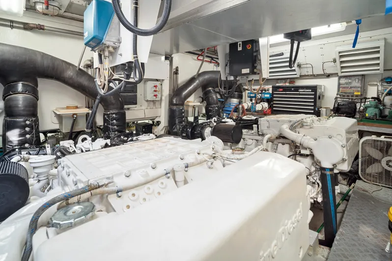 Gabriela G Yacht Photos Pics Engine room of a 2001 Mangusta 72 yacht, featuring complex machinery and equipment.