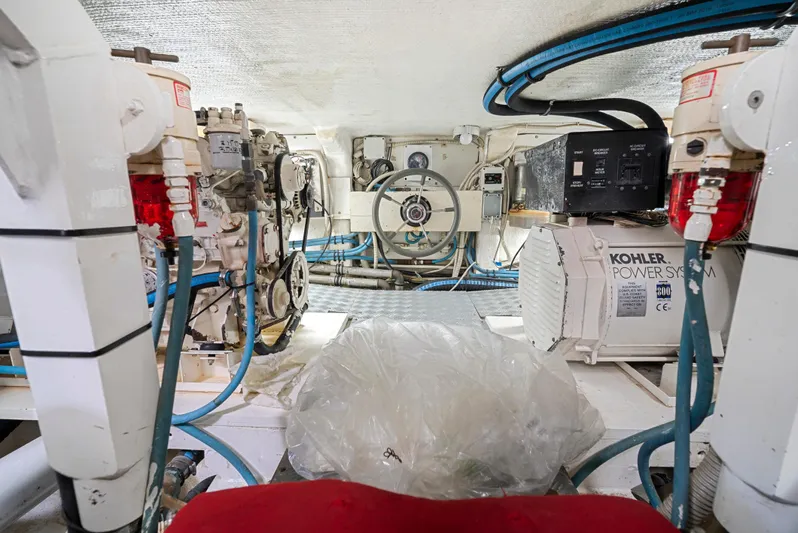 Gabriela G Yacht Photos Pics Engine room of a 2001 Mangusta 72 yacht, featuring Kohler power systems and mechanical equipment.