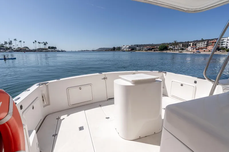 Sunny 1 Yacht Photos Pics 2001 Riviera 36 Flybridge boat deck with scenic waterfront view.