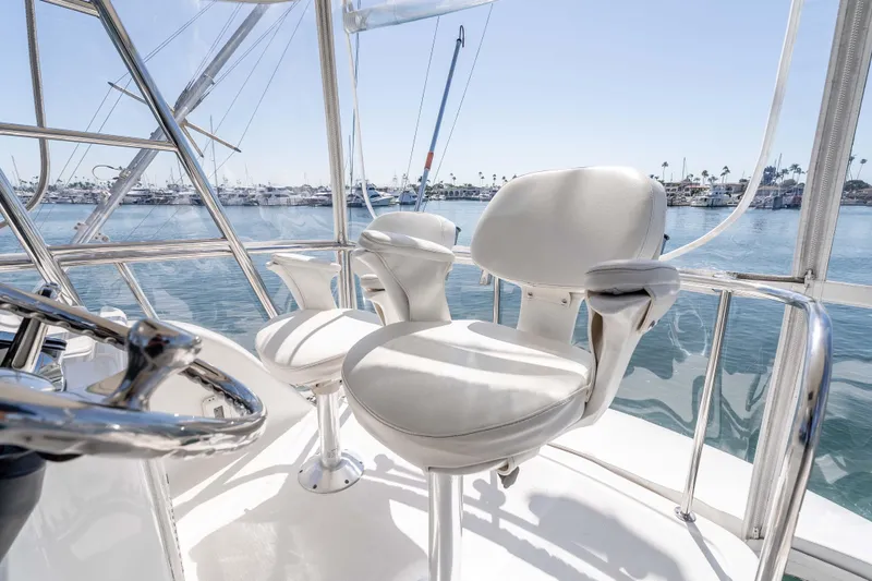 Sunny 1 Yacht Photos Pics Flybridge seating on 2001 Riviera 36 yacht with marina view.