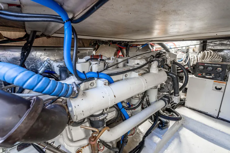Sunny 1 Yacht Photos Pics Engine room of 2001 Riviera 36 Flybridge with Onan Marine GenSet and blue wiring.