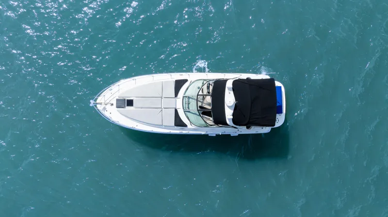 Genesis Yacht Photos Pics Top view of a 2003 Sea Ray 380 Sundancer yacht on blue water.